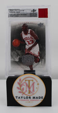 2009-10 Upper Deck Jordan Legacy #22 Michael Jordan Jersey Fusion BGS - Card front with red swatch